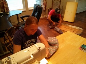 Sewing some seat covers to reupholster a few benches in the 1960's trailer!