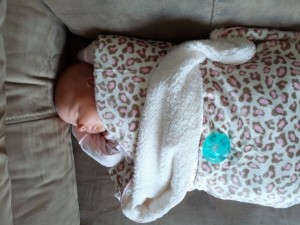 sleepy baby in her new blanket