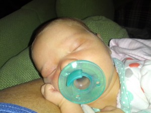 this girl LOVES the pacifier