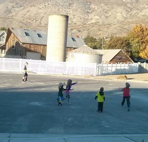 Cali playing football in the street with the neighbors - i'm hoping my kids get lots of opportunities to do this